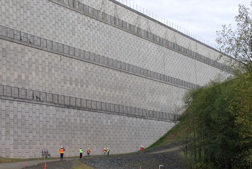 Soils nails and rock anchors offer embankment and slope stablisation, here is an Airport tall tiered wall.