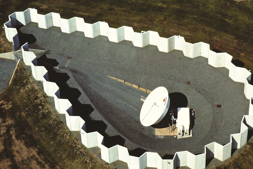 Precast concrete barrier, FanWall, used to secure a large satellite dish.