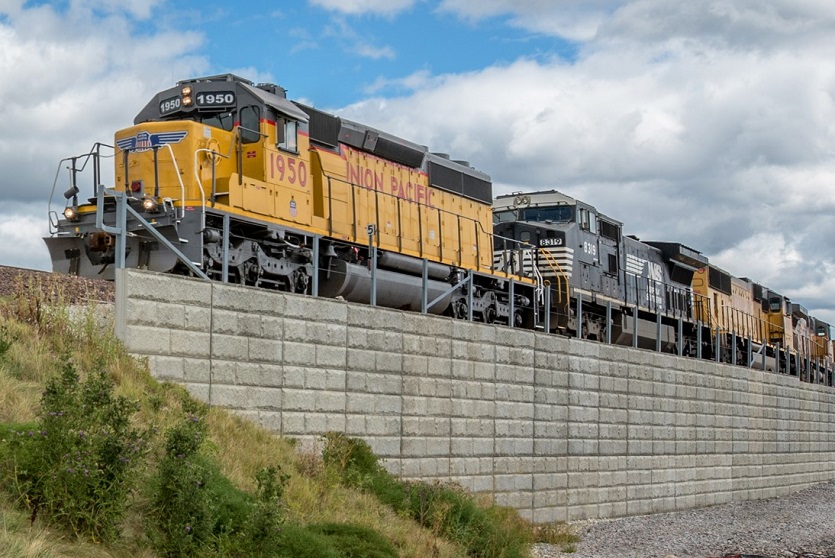 The T-Wall precast modular retaining wall by Geoquest pictured used as a retaining wall for rail infrastructure.