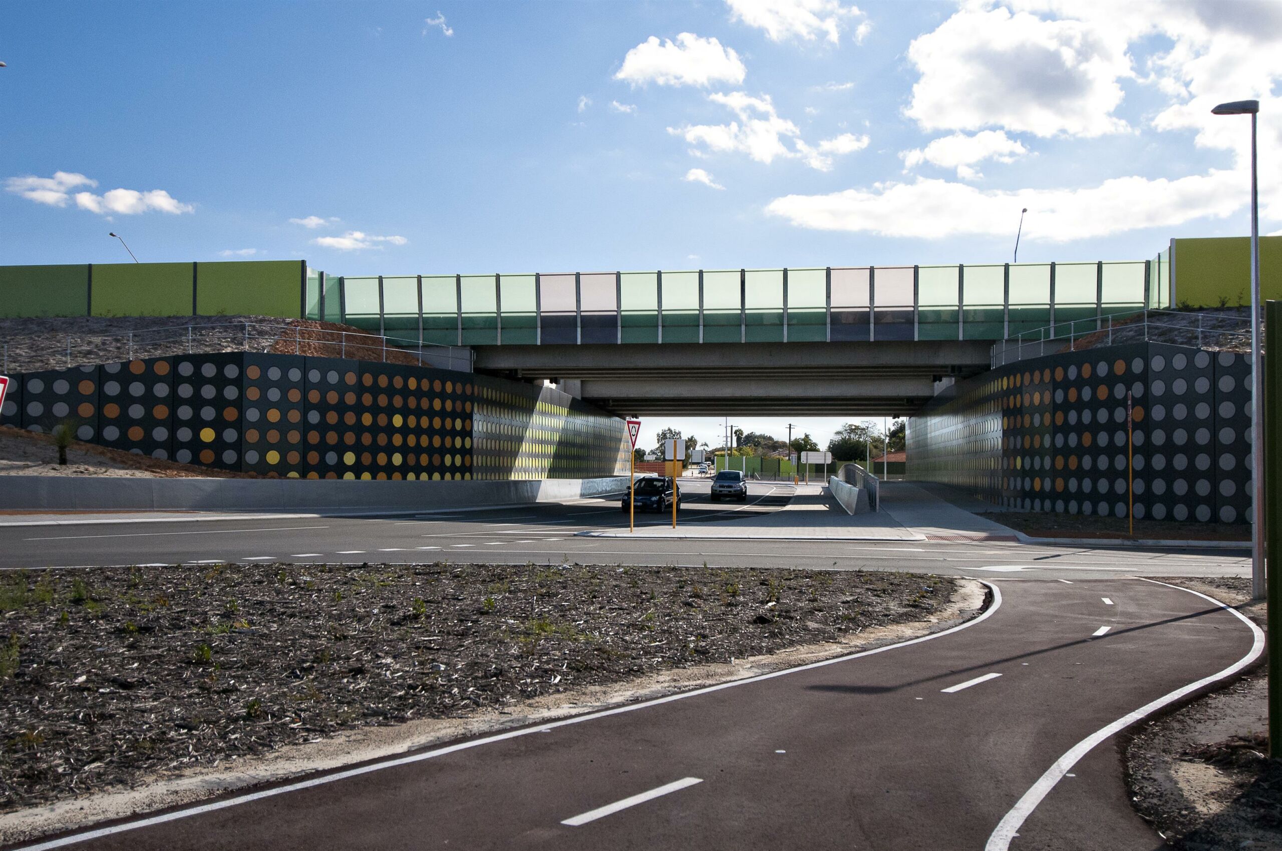 TerraTilt precast concrete retaining walls and bridge over a road and cycle path.