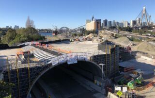 Tunnel construction in Sydney with Sydney harbour inthe background: Geoquest Supports Transformation in Sydney’s Transportation Landscape