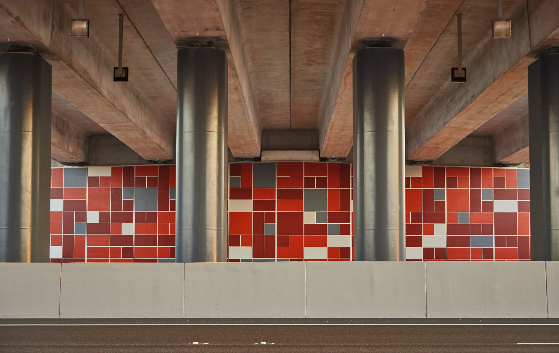 TerraTilt precast concrete retaining walls under a road bridge.