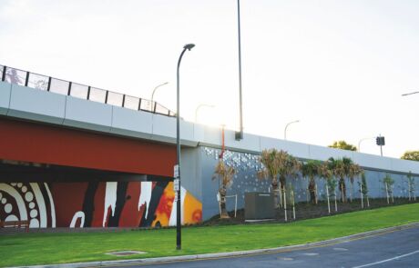 Ovingham Level Crossing Removal Project, completed reinforced earth precast walls by Geoquest Company, known as TechWall, forms the backdrop for local First Nations artworks.