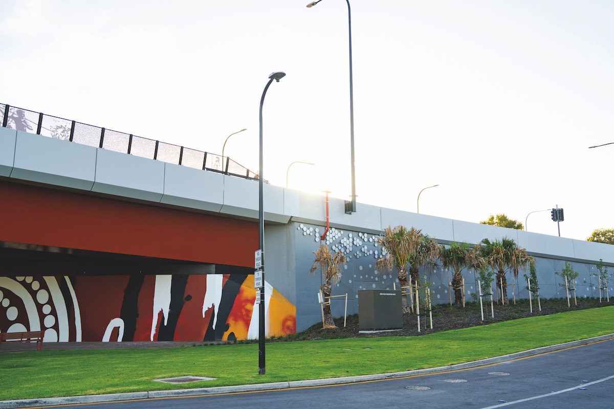 Ovingham Level Crossing Removal Project, completed reinforced earth precast walls by Geoquest Company, known as TechWall, forms the backdrop for local First Nations artworks.