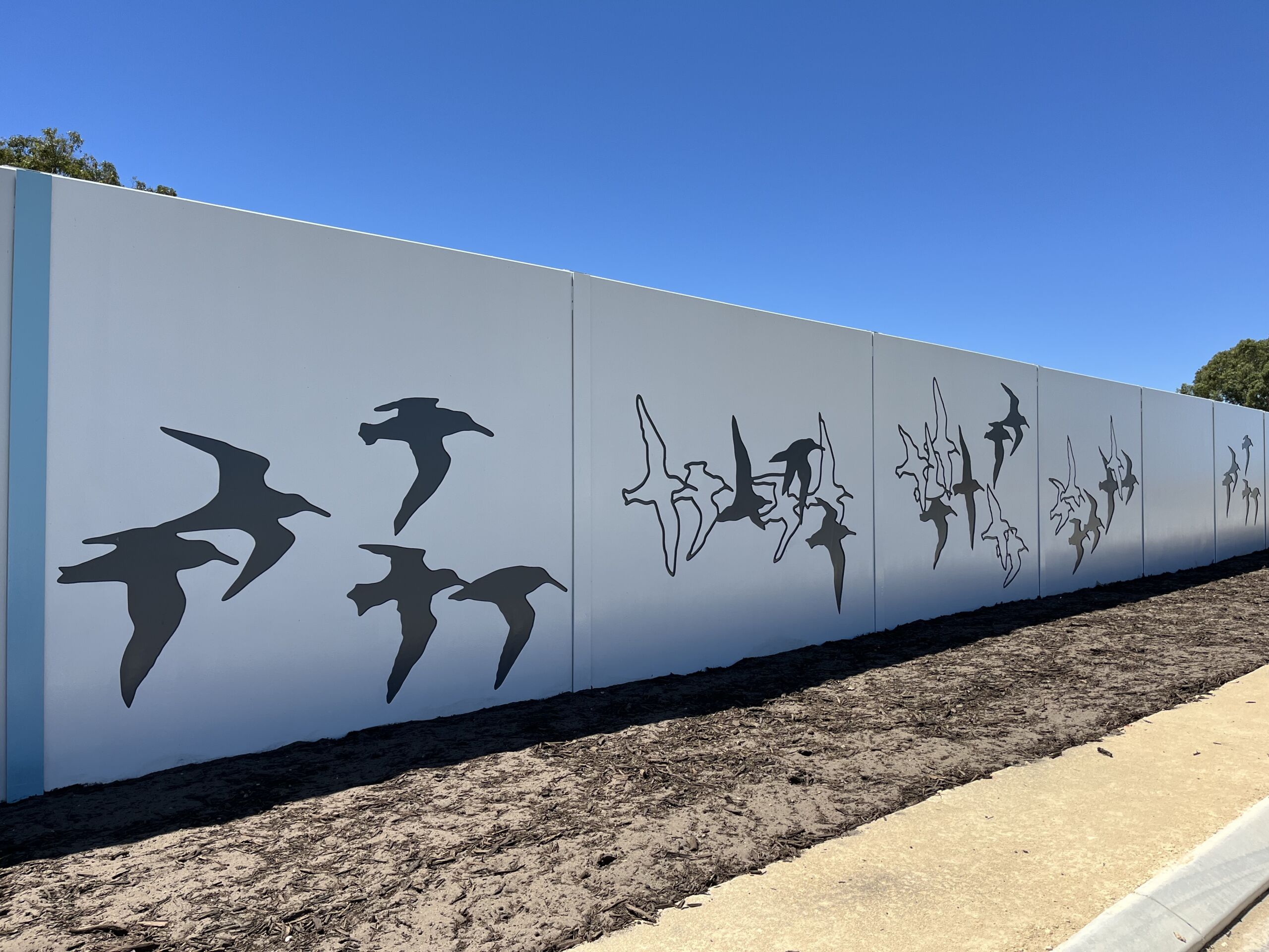 Bespoke decorative precast concrete noise walls with architectural designs, installed in Mandurah, Western Australia.